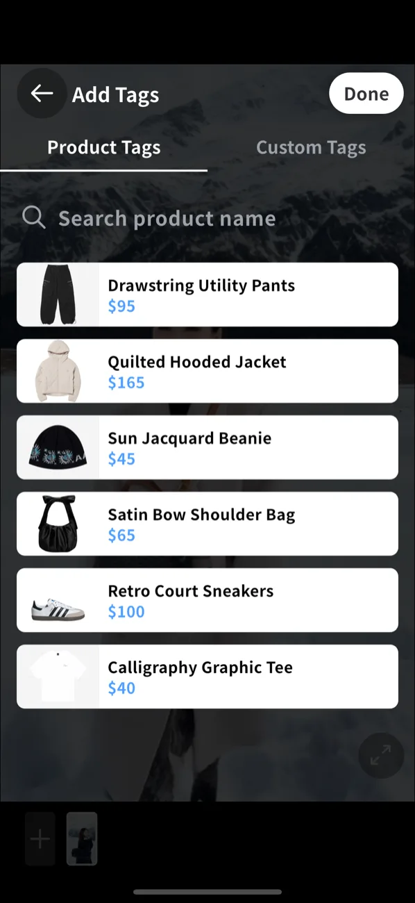 Add Tags on mobile. Product Tags / Custom Tags tabs, a product search, and the Shopify catalog (Drawstring Utility Pants $95, Quilted Hooded Jacket $165, Sun Jacquard Beanie $45, Satin Bow Shoulder Bag $65, Retro Court Sneakers $100, Calligraphy Graphic Tee $40) with a Done button.